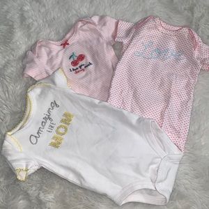 3 Carter’s Newborn Onesies